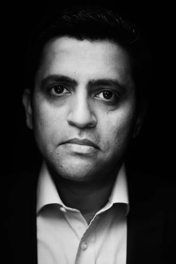 Black-and-white editorial portrait of Himanshu Kher